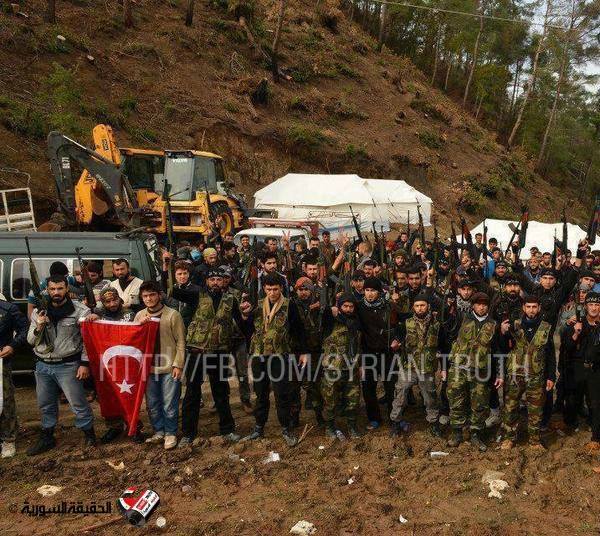 Photo of Photo- Inhuman Americanized Mujaheeds in Syria holding Turkish Flag