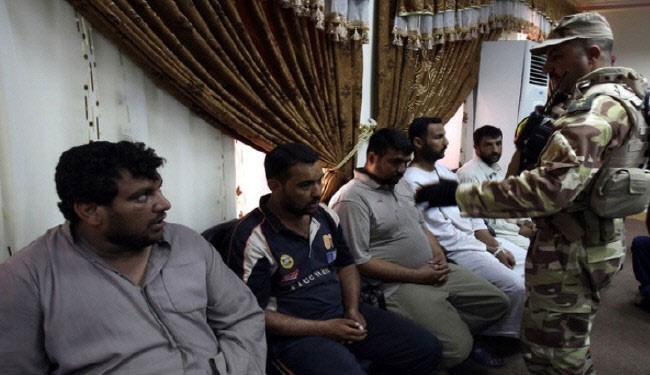 Photo of 23 armed militants surrender to Syrian authorities