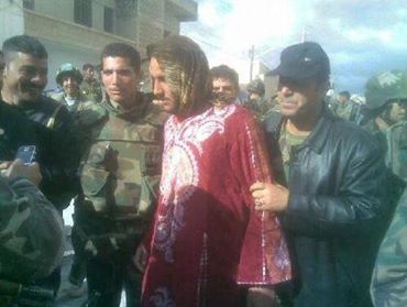 Photo of Ahrar Al Sham brigade commander, former FSA, dressed like a woman in order to escape through a checkpoint