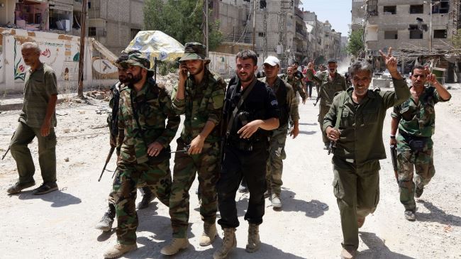 Photo of Syrian army forces recapture town near Damascus