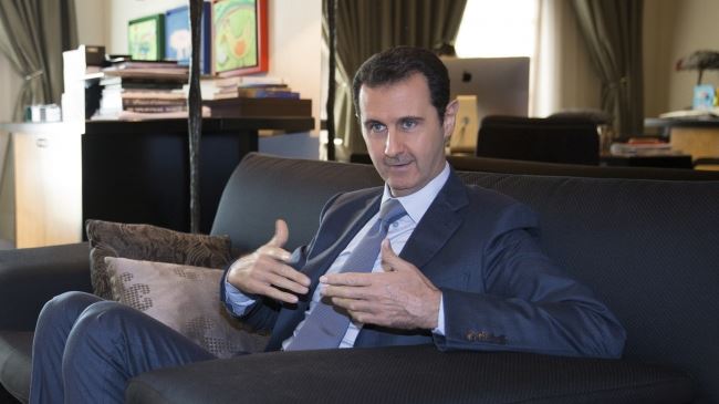 Photo of President Bashar al-Assad: US-led coalition airstrikes in Syria illegal