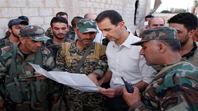 Photo of Photos- President Assad attends iftar on frontline with troops
