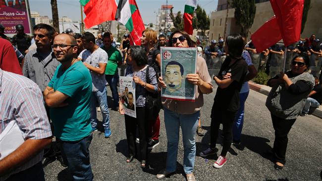 Photo of Palestinians march against world silence on hunger striking prisoner