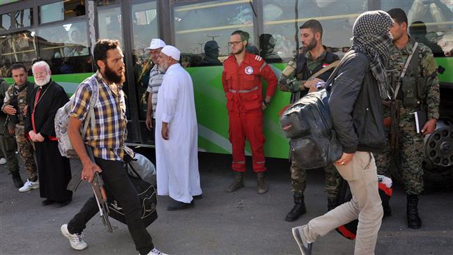 Photo of More than 130 militants leave Syria’s Homs under govt. deal