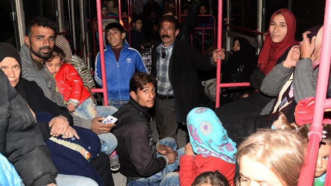 Photo of Civilians fleeing militant-held side of Syria’s Aleppo