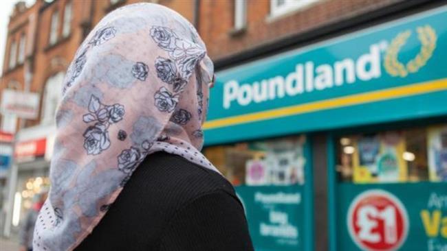 Photo of Muslim woman dragged on sidewalk in London