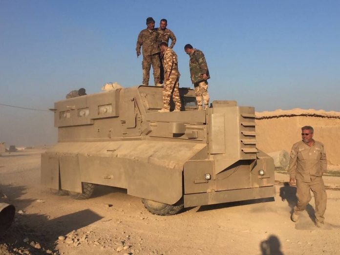 Photo of Iraqi forces encircle ISIL stronghold near Syrian border