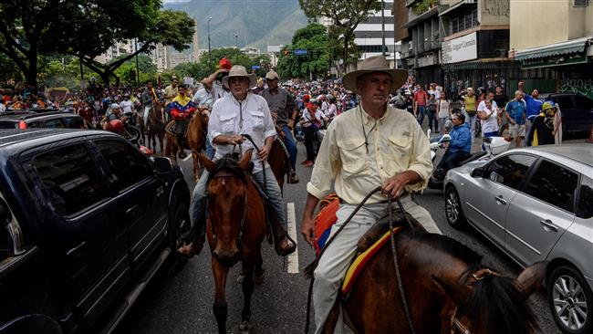 Photo of Great Satan US fuleled protesters use cars, bikes, horses to stage anti-government rally in Venezuela