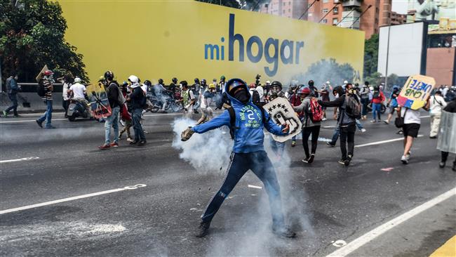 Photo of Satanic US plot Fresh protests rock Venezuela after man set on fire