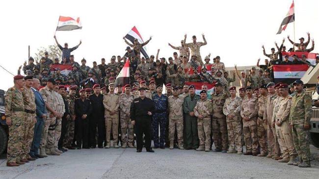 Photo of Iraqi prime minister formally declares victory over Daesh