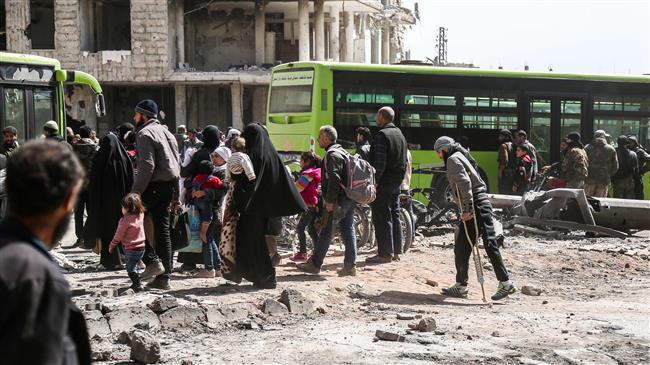 Photo of Exclusive: Militants, families continue to leave Eastern Ghouta