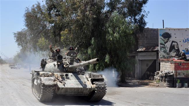 Photo of Syrian army soldiers advance against terrorists in southern Damascus
