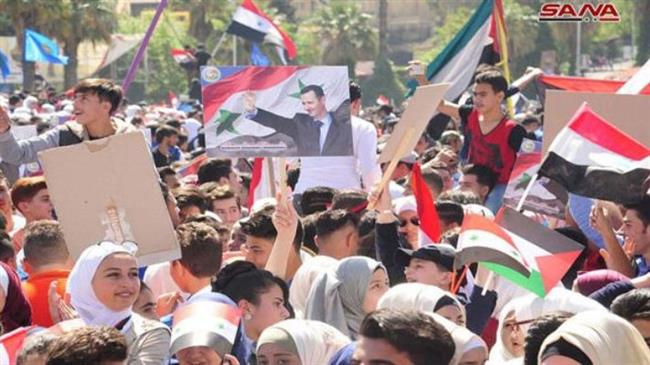 Photo of PHOTOS: Syrians rally in Damascus in support of Assad against Satanic US-led strikes