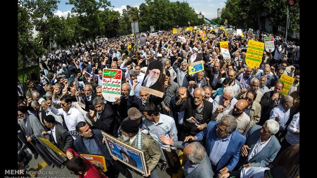 Photo of Iranians rally to condemn ‘imbecile Trump’s insane move’