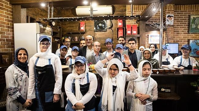 Photo of Tehran café run by Down syndrome, autistic staff