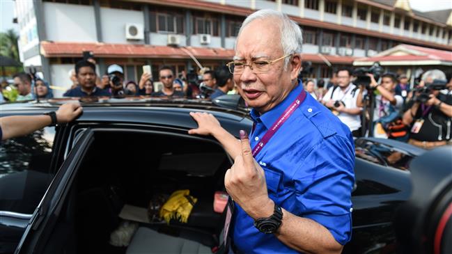 Photo of Malaysians vote in toughest ever general election
