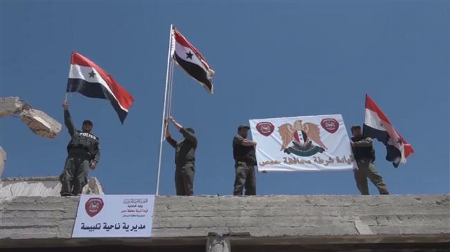 Photo of Syria: Cheers as Syrian flag raised in Homs
