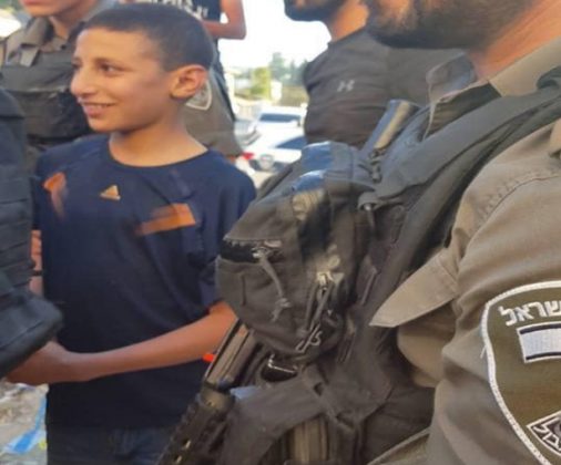 Photo of 9 Year Old Brave Palestinian Boy Laughs At zionist Forces As They Arrest Him