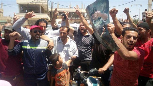 Photo of People celebrate as Syrian army purges more towns of terrorists