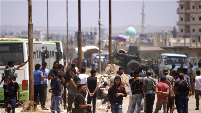 Photo of Syria militants begin leaving Dara’a under surrender deal
