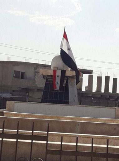 Photo of Syrian Army raises flag over Hasakah district formerly controlled by Kurdish forces
