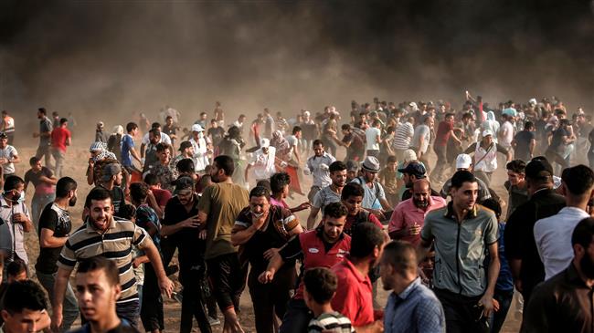 Photo of Terrorist israeli forces attack Palestinian protesters in Gaza, injure 240